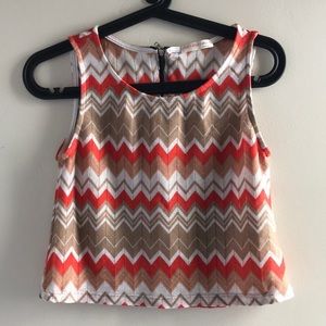 Orange and tan geometric print sleeveless blouse